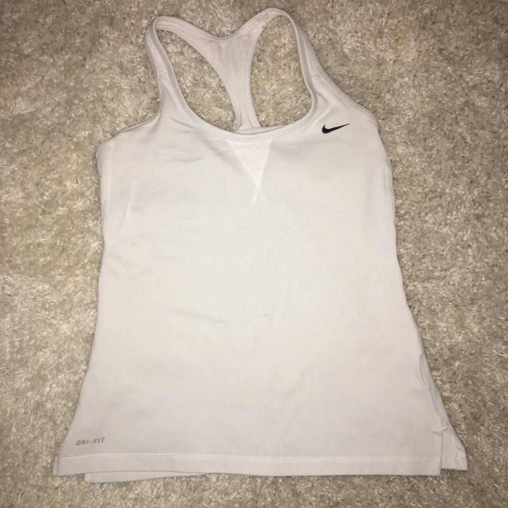 Pink and white nike tank tops.